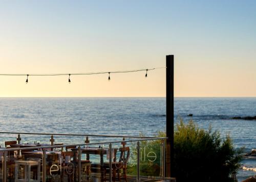 a view of the ocean from a restaurant at High Beach Resort in Malia