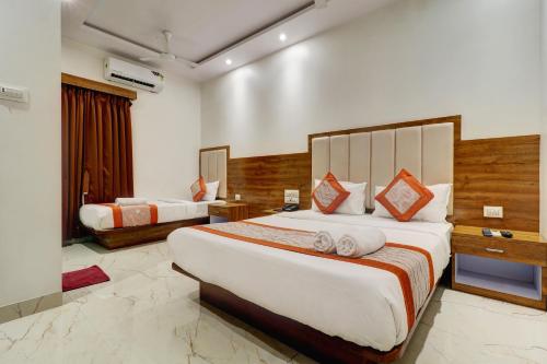 a bedroom with a large bed in a room at Hotel A K Fort Inn in Mumbai