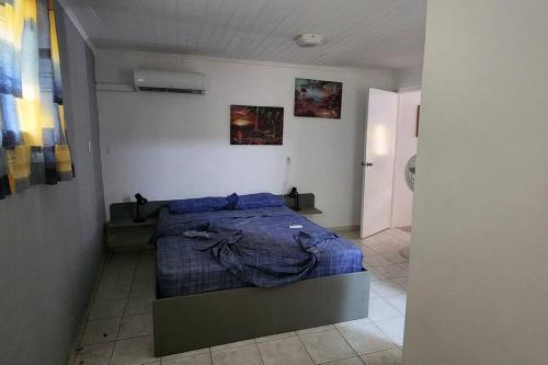 Ένα ή περισσότερα κρεβάτια σε δωμάτιο στο Veeris Apartments