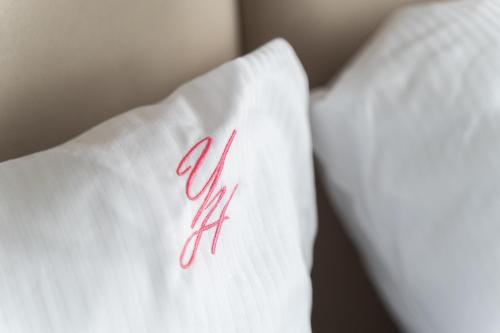 a white pillow with the word ally on it at Your Holidays Waves in Międzyzdroje