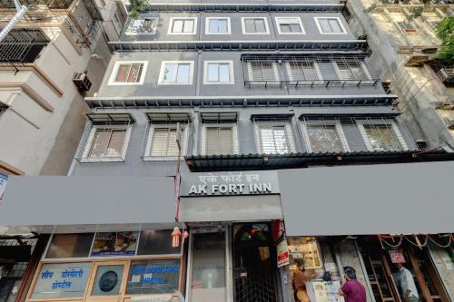 an apartment building with a sign in front of it at Hotel A K Fort Inn in Mumbai