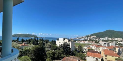 a view of a city with the ocean and buildings at Panorama Apartments in Budva