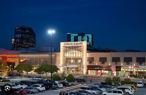 a parking lot with cars parked in front of a building at 1 - Brand New Luxury 1Bdr,1Bath in Atlanta GA in Atlanta