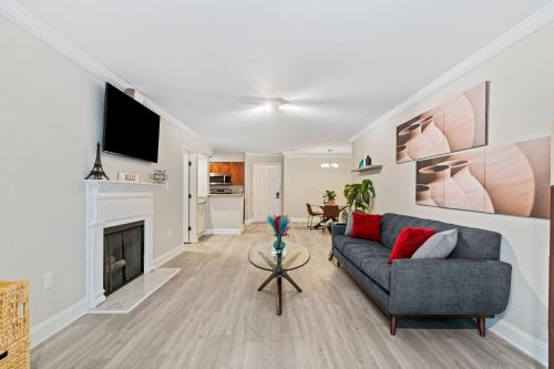 a living room with a couch and a fireplace at 1 - Brand New Luxury 1Bdr,1Bath in Atlanta GA in Atlanta