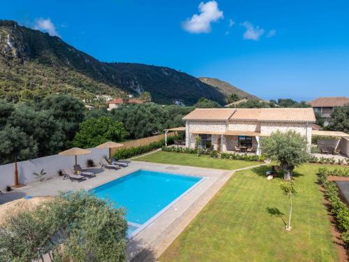 a villa with a swimming pool and a house at YANNIS RETREAT in Lefkada Town
