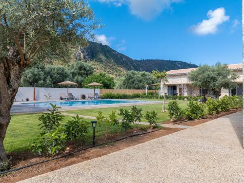 a swimming pool in a yard with a house at YANNIS RETREAT in Lefkada Town