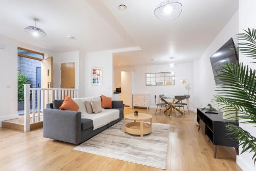 a living room with a couch and a table at 1 Bed Apartment - Redhill Central, Surrey, Gatwick #4 in Redhill