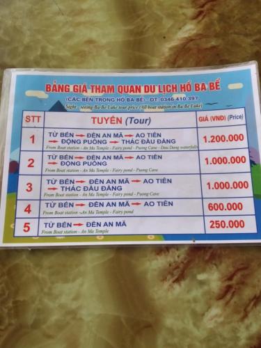a sign with a price list on top of food at Thành Luân Hotel in Bak Kan
