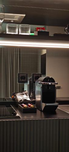 a kitchen with a counter top with a microwave at Zeta Rentals in Bari