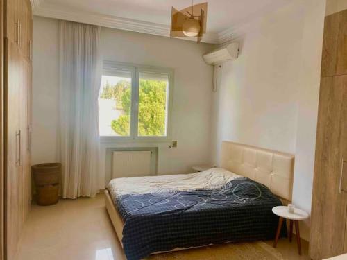Postel nebo postele na pokoji v ubytování Appartement haut standing à Menzeh5