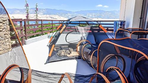 a balcony with a basketball hoop and a net at Mila's pet friendly holiday house in Pag