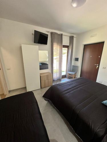 Postel nebo postele na pokoji v ubytování Agriturismo L'Oasi