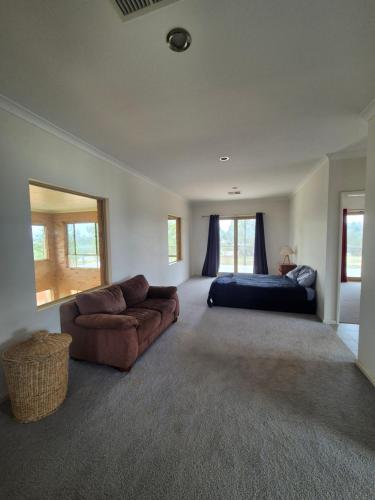 a large living room with a couch and a bed at Turquoise Coast Lodge in Jurien Bay
