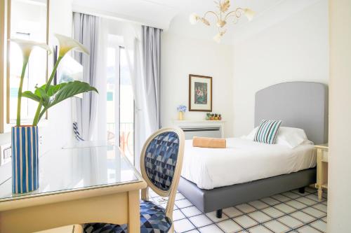 Postel nebo postele na pokoji v ubytování La Reginella Resort & Spa