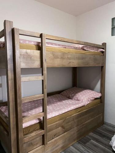 a couple of bunk beds in a room at Ubytování U Cesty in Krumvíř