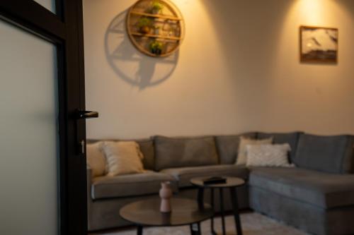 a living room with a couch and a table at Noard 41 in Workum