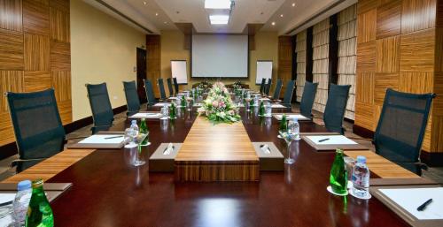 a large conference room with a long table and chairs at City Seasons Hotel & Suites Muscat in Muscat