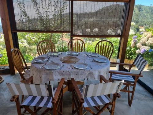 a table with chairs and a tablecloth on a table at Quiet Countryside Nature Retreat in Santa Cruz