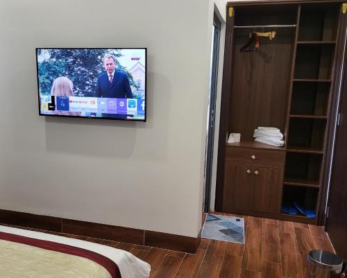 a tv on the wall of a hotel room at RUBY HOTEL Vĩnh Long in Vĩnh Long