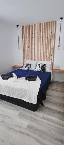 a bedroom with a large bed in a room at Azure Sunset in Ponta Delgada