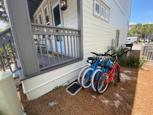 two bikes parked on the side of a house at The Holland House II in Rosemary Beach