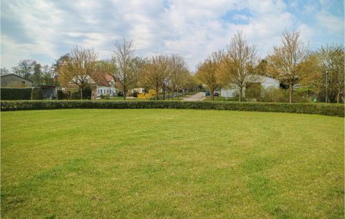 a large grassy field in a residential neighborhood at Lovely Apartment In Krakow Am See in Krakow am See