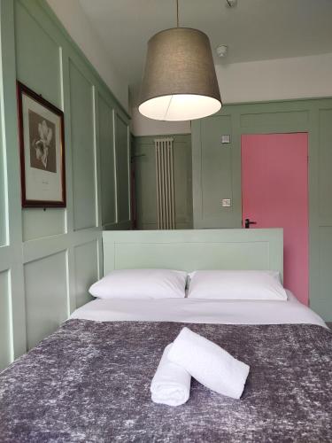 a bedroom with a bed with a pillow on it at The Willows in Brighton & Hove