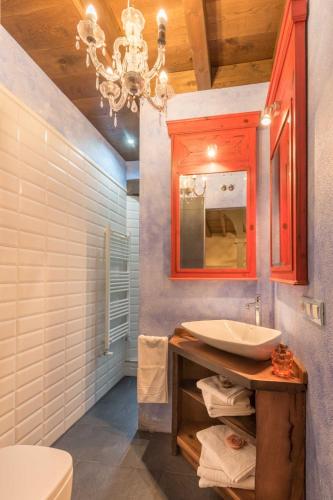 a bathroom with a sink and a mirror at El Pozon De Los Abuelos in Tezanos
