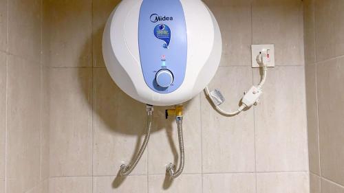 a close up of a shower in a bathroom at Good and Comfy 1BR (No Kitchen) at Citra Living Apartment By Travelio in Jakarta