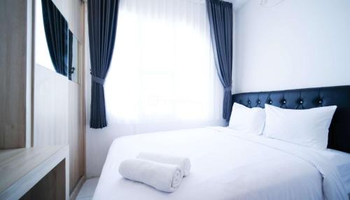Postel nebo postele na pokoji v ubytování Best Location and Restful 1BR at The City Square Apartment By Travelio