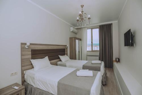 Postel nebo postele na pokoji v ubytování Royal Medis Hotel