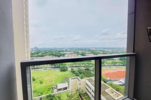 a view from the window of a building at Comfy and Nice 2BR Branz BSD City Apartment By Travelio in Tangerang