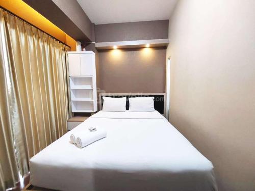 Postel nebo postele na pokoji v ubytování Modern Look 1BR at Uttara The Icon Apartment By Travelio