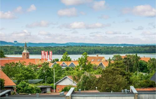 a view of a town with a river and buildings at 1 Bedroom Awesome Apartment In Ebeltoft in Ebeltoft