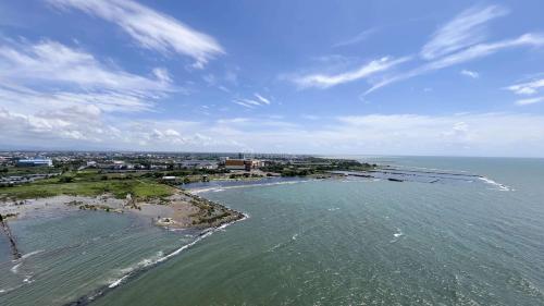 an aerial view of a beach and the ocean at Good Choice Studio at Delft Ciputra Makassar Apartment By Travelio in Sungguminasa
