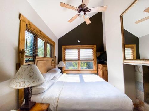 a bedroom with a bed and a ceiling fan at 2 BR Condominium - Luxury Skiin and out (rare to find) in Telluride