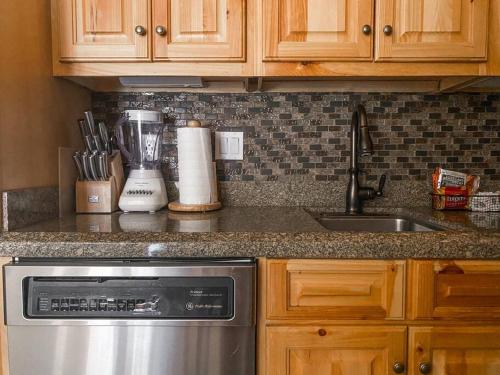 a kitchen counter with a sink and a dishwasher at 2 BR Condominium - Luxury Skiin and out (rare to find) in Telluride
