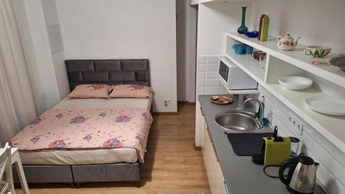 Postel nebo postele na pokoji v ubytování Tempo Life Apartman