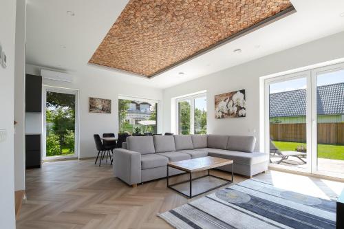 a living room with a couch and a table at Posti villa in Pärnu