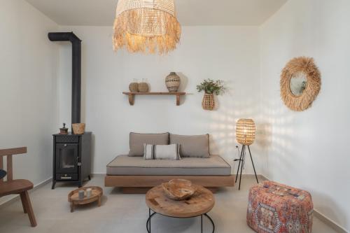 a living room with a couch and a table at St-Ten Stone Built Village in Áyioi Dhéka