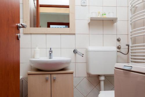 a bathroom with a sink and a toilet at Apartment Dream4you in Zagreb