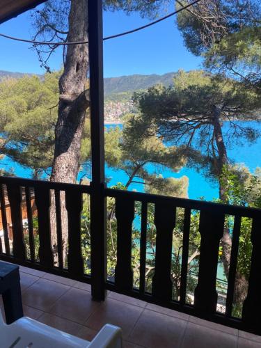 a room with a view of the water from a balcony at Villaggio Smeraldo in Moneglia