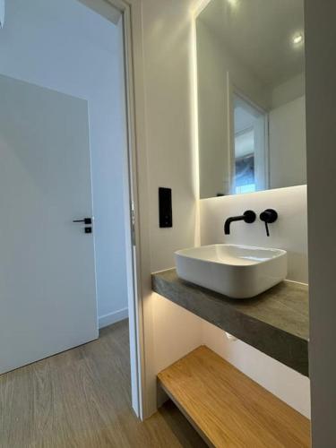a bathroom with a sink and a mirror at BlueMotion - CruiseNest 6Β in Piraeus