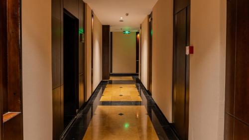 a long hallway with a long floor and some buildings at Milan Park Hotel in Taif