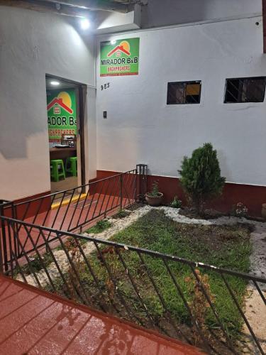 a store with a sign on the side of a building at Mirador Backpackers B&B in Huaraz