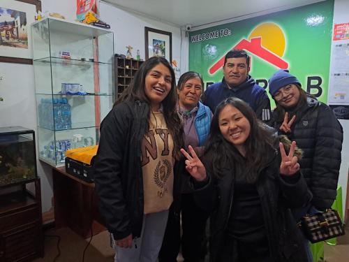 a group of people posing for a picture in a store at Mirador Backpackers B&B in Huaraz