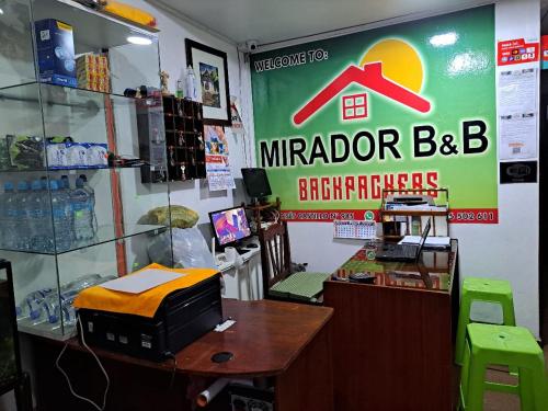a store with a computer on a table in a room at Mirador Backpackers B&B in Huaraz