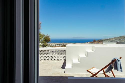 a room with a view of the ocean from a window at Dream Santo Villa in Vóthon