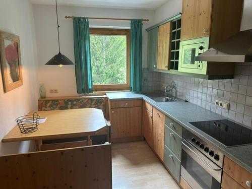a kitchen with a sink and a counter top at Gasthof Zum Lendwirt in Westendorf