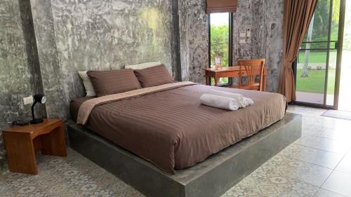 Ένα ή περισσότερα κρεβάτια σε δωμάτιο στο Green Tree Cottage3